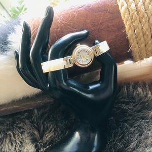 Xanadu faux shell mother of pearl face gold tone bracelet style watch